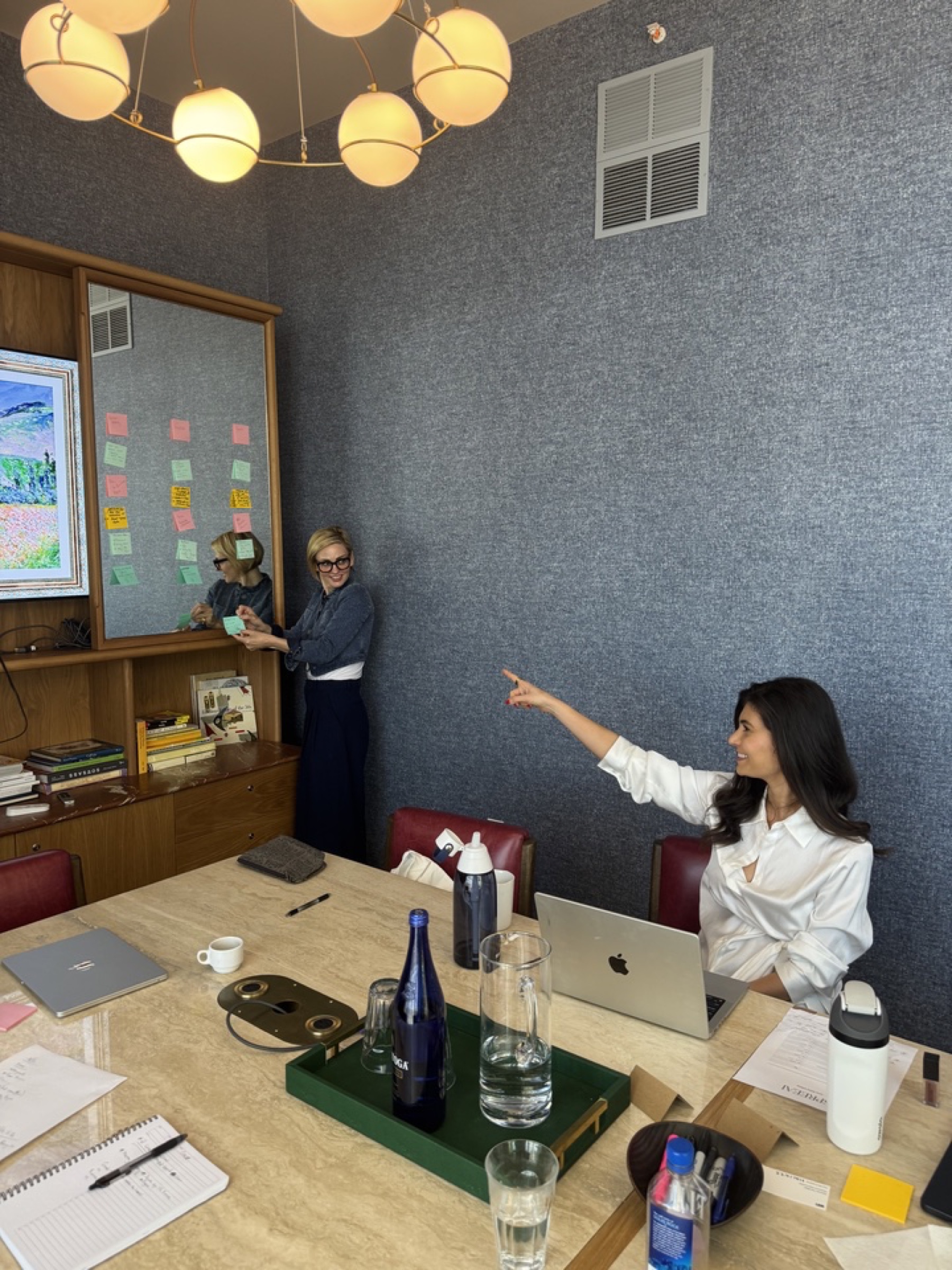 Two SPREEAI teammates exchanging ideas during an in-person working session